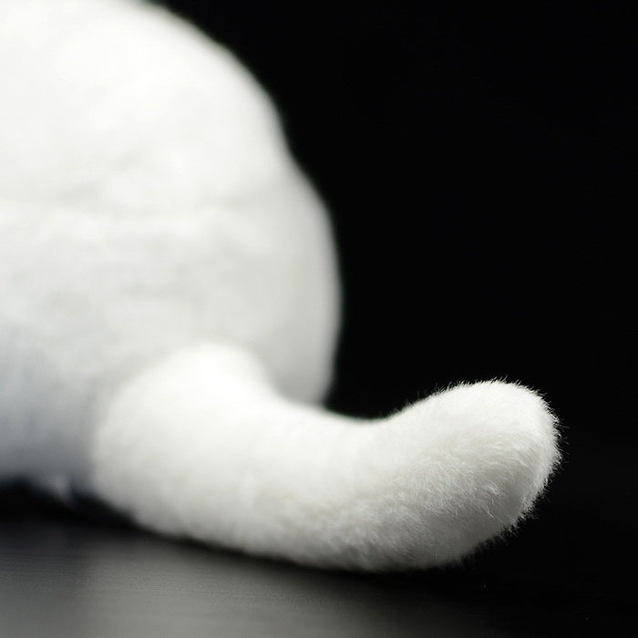 Tail detail of the white cat plush toy, showcasing its fluffy and realistic design for cat lovers