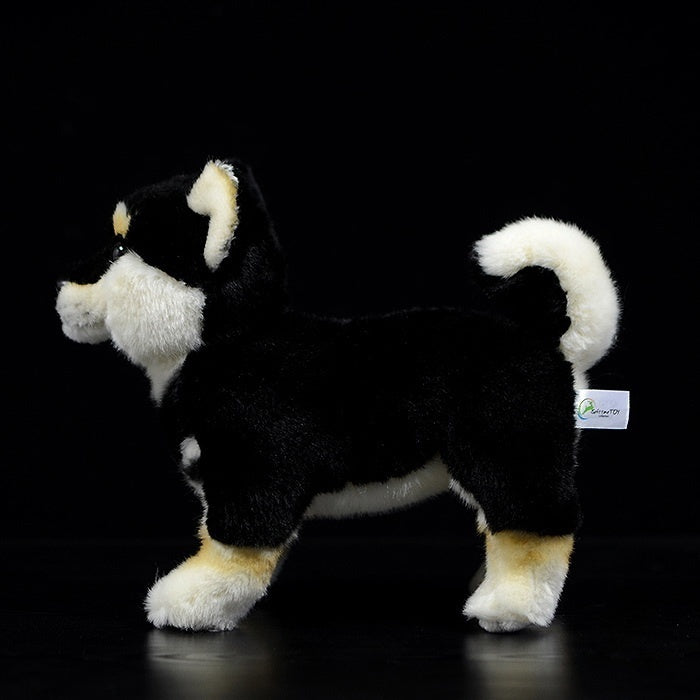Side profile of a Black & Tan Shiba Inu plush toy, highlighting its curled tail and detailed design