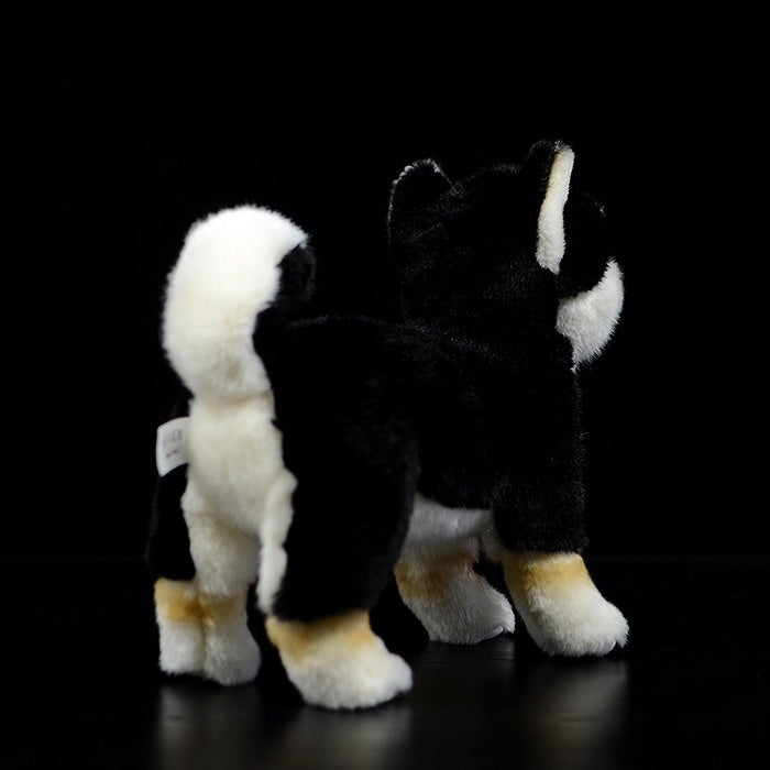 Back view of a Black & Tan Shiba Inu plush toy, featuring its fluffy tail and soft fur texture