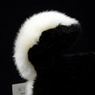 Detailed view of the Black & Tan Shiba Inu plush toy’s curled tail with a fluffy black and white finish