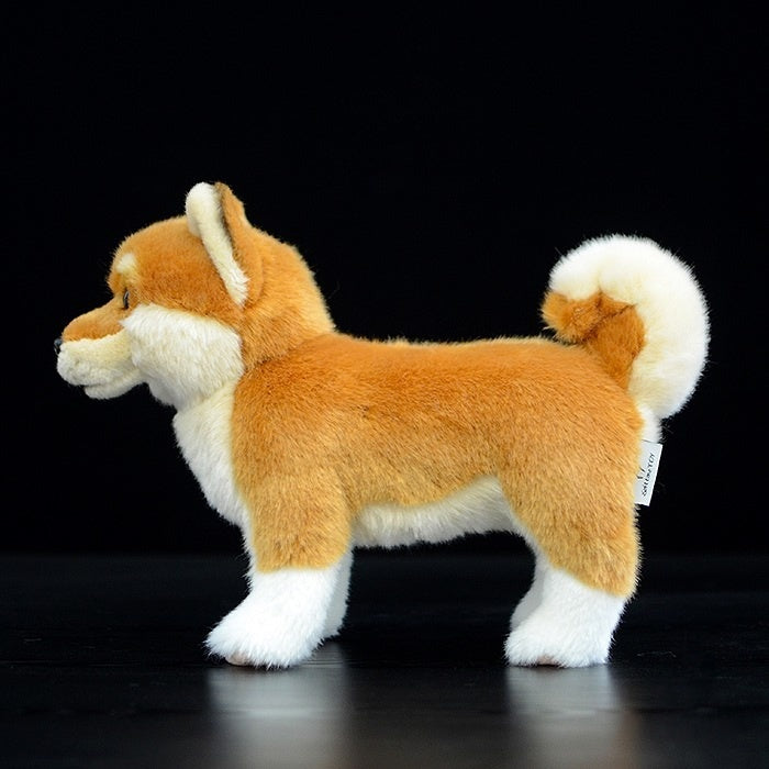 Side view of a Shiba Inu plush toy highlighting its curled tail and detailed craftsmanship
