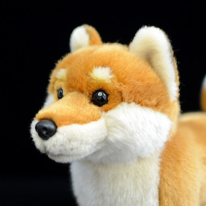 Close-up of the Shiba Inu plush toy’s lifelike face, featuring soft fur and realistic details