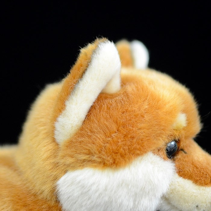 Close-up of Shiba Inu plush toy’s pointed ears, crafted with attention to realistic details