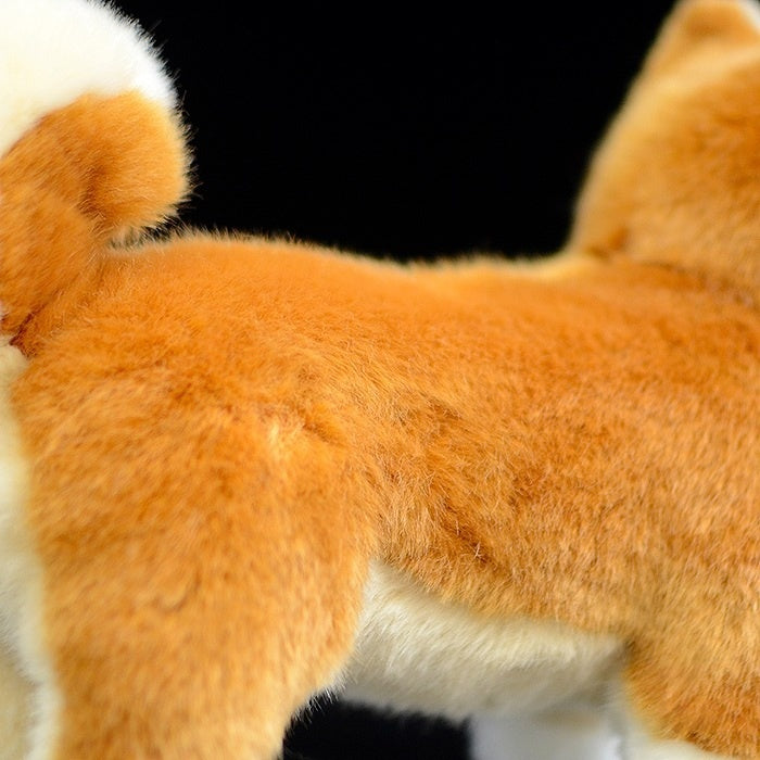Back view of Shiba Inu plush toy showcasing its curled tail and lifelike fur texture