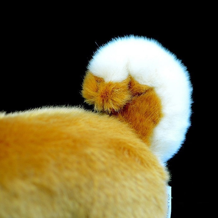Close-up of Shiba Inu plush toy’s fluffy curled tail, designed to mimic the real dog’s charm