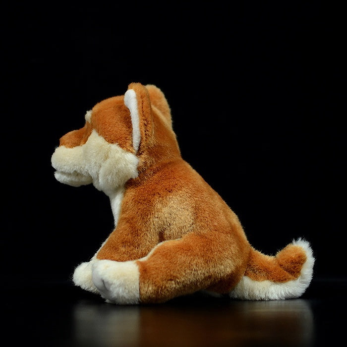 Side view of a lifelike Shiba Inu plush toy showcasing its fluffy tail and detailed craftsmanship
