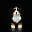 Front view of a Bernese Mountain Dog plush toy with a lifelike face and soft, cuddly texture