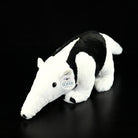 Rear view of a Southern Tamandua stuffed animal, showing its detailed back and fluffy tail