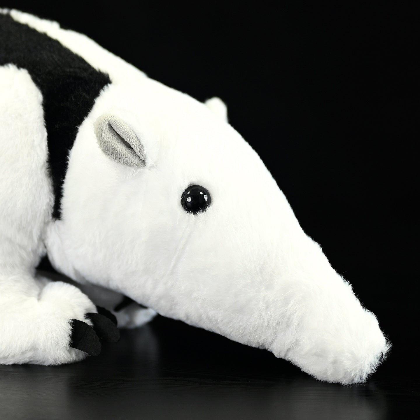 Close-up of Southern Tamandua plush toy's face, capturing its realistic design and intricate details