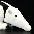 Close-up of a Southern Tamandua plush toy’s head, featuring realistic ears and soft material