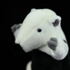 Close-up of a Southern Tamandua plush toy’s head, featuring realistic ears and soft material