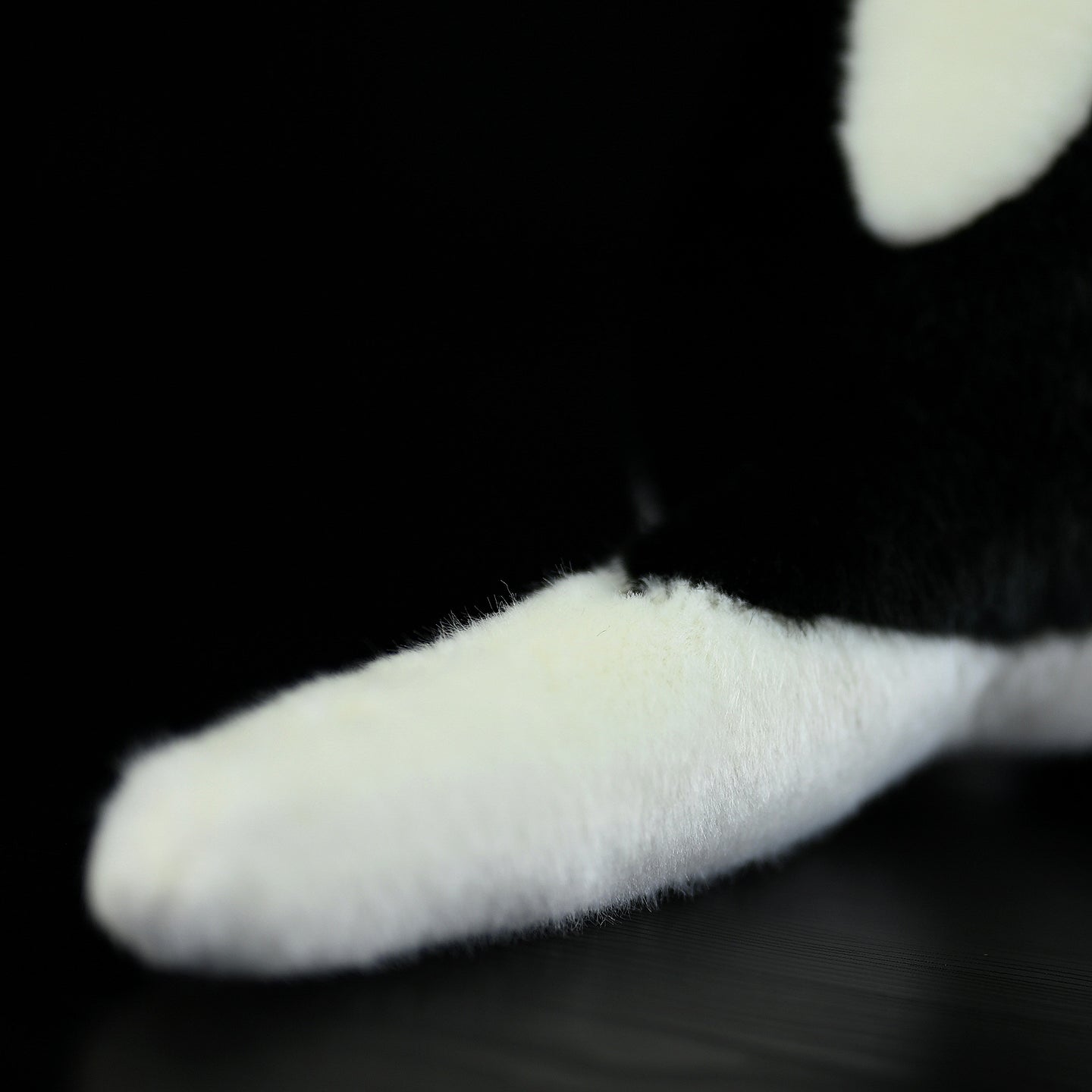 Zoomed-in image of the Southern Tamandua plush toy’s tail, highlighting its fluffy and soft texture