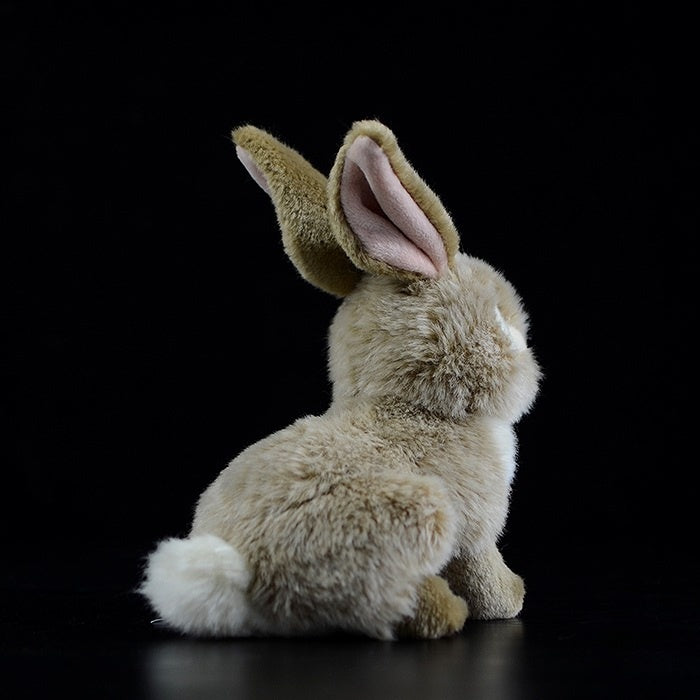 Back view of brown hare rabbit plush toy, showing its detailed ears and fluffy tail for a lifelike appearance