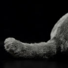 Close-up of the tail of British Blue Shorthair plush toy, showcasing its fluffy, lifelike design