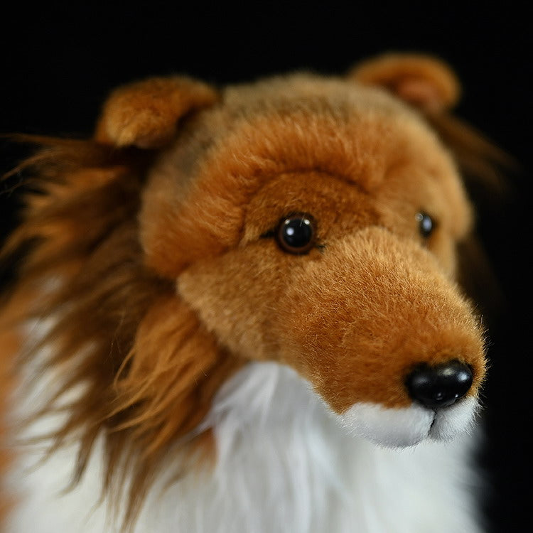 Close-up of Shetland Sheepdog plush toy’s face, showing lifelike eyes and soft fur for Sheltie lovers