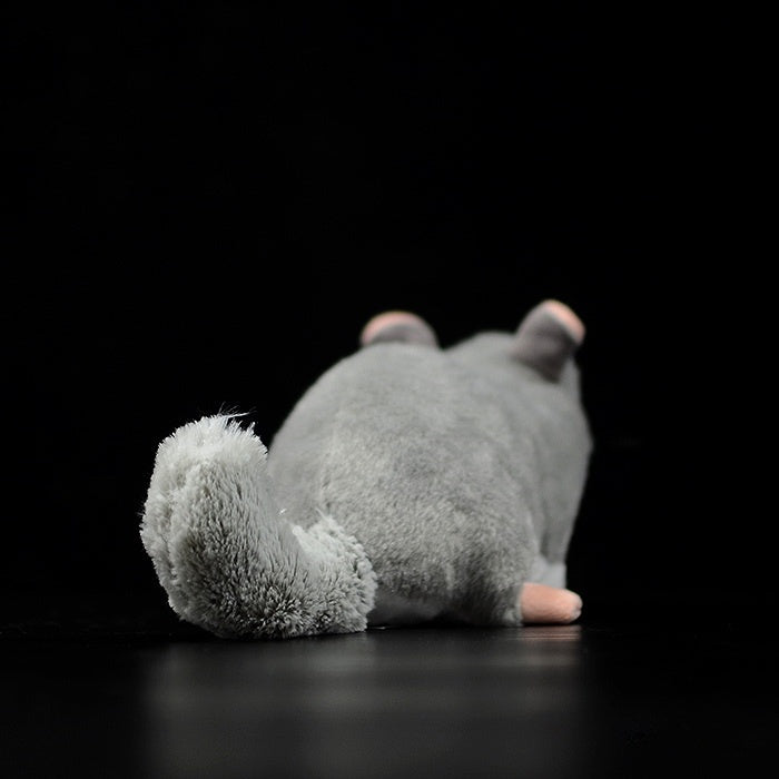 Rear view of a chinchilla plush toy with a detailed fluffy tail, perfect for animal lovers