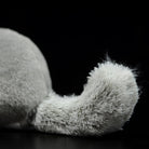 Detailed view of a chinchilla plush toy's fluffy tail, perfect for collectors and animal enthusiasts
