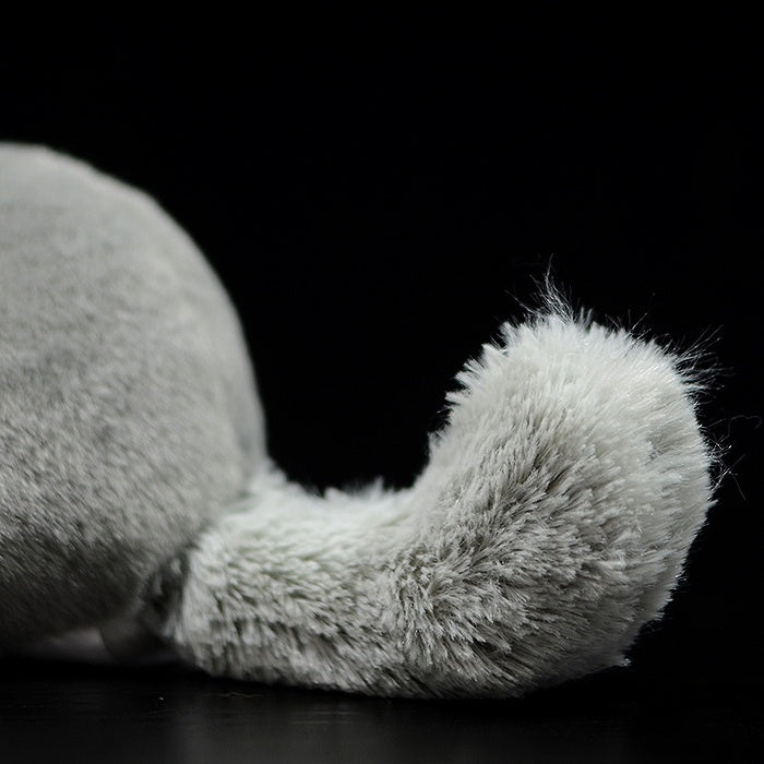 Detailed view of a chinchilla plush toy's fluffy tail, perfect for collectors and animal enthusiasts