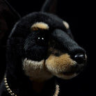 Close-up of SoftDaysLab Doberman plush toy's face, featuring lifelike eyes and detailed fur texture