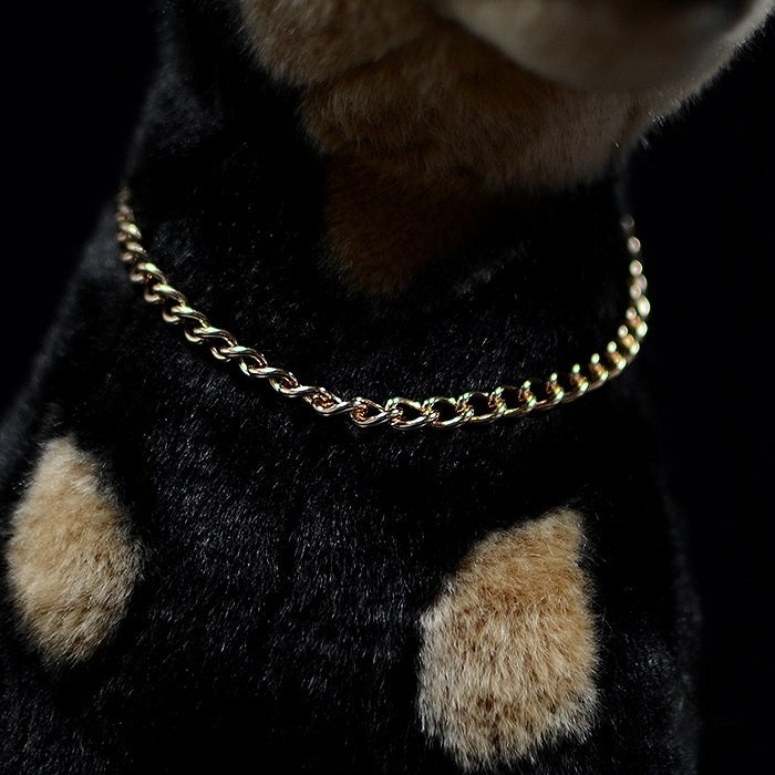 Gold chain detail on the realistic Doberman plush, adding elegance to its lifelike design