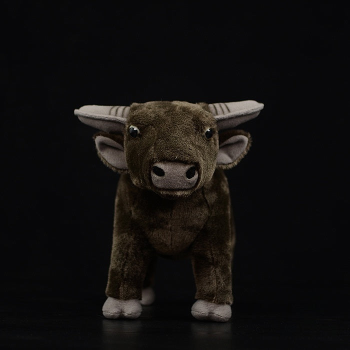 Front view of a lifelike water buffalo stuffed animal, showcasing realistic design and charm