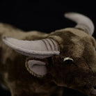 Detailed close-up of water buffalo plush toy’s horns and ears, showcasing lifelike craftsmanship