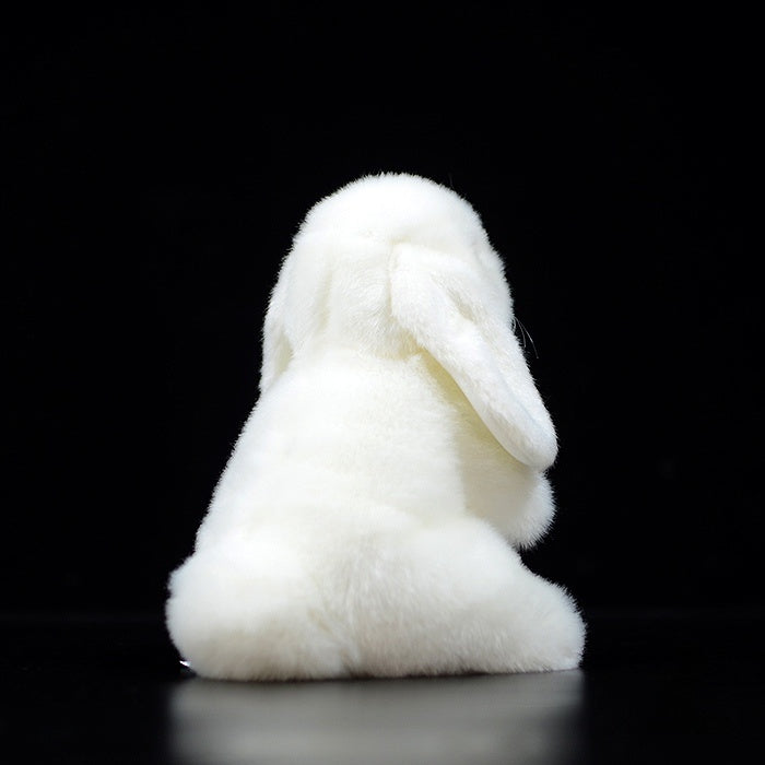 Back view of a soft white lop-eared rabbit plush toy, highlighting its fluffy and realistic design