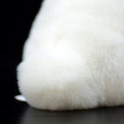 Fluffy tail of the white lop-eared rabbit plush, perfect for bunny lovers seeking soft and realistic toys