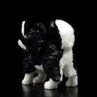 Back view of a Siberian Husky plush toy, highlighting its fluffy tail and soft fur texture