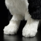 Close-up of the plush Husky’s soft paws, showcasing its high-quality and realistic design