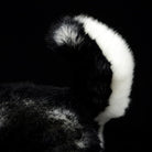 Fluffy tail of a Siberian Husky plush toy, showcasing the lifelike fur texture and attention to detail
