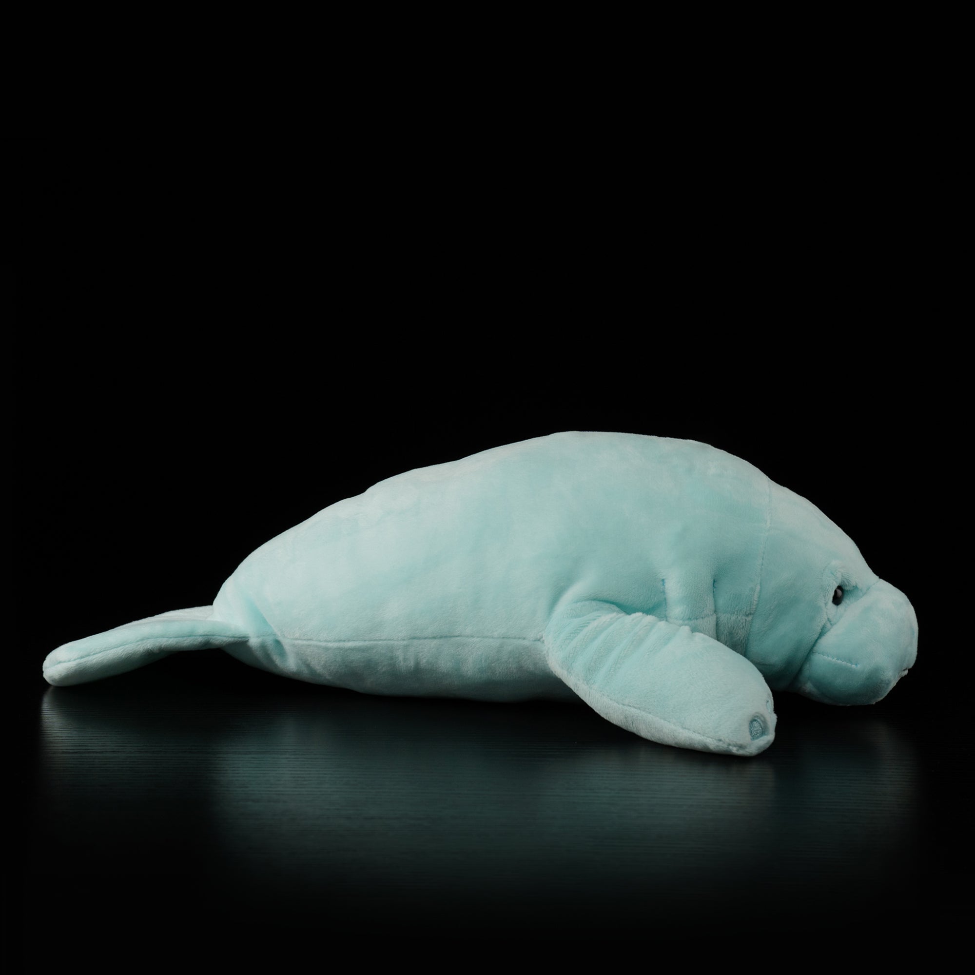 Side profile of cuddly manatee plush by SoftDaysLab®, featuring detailed flippers and smooth texture