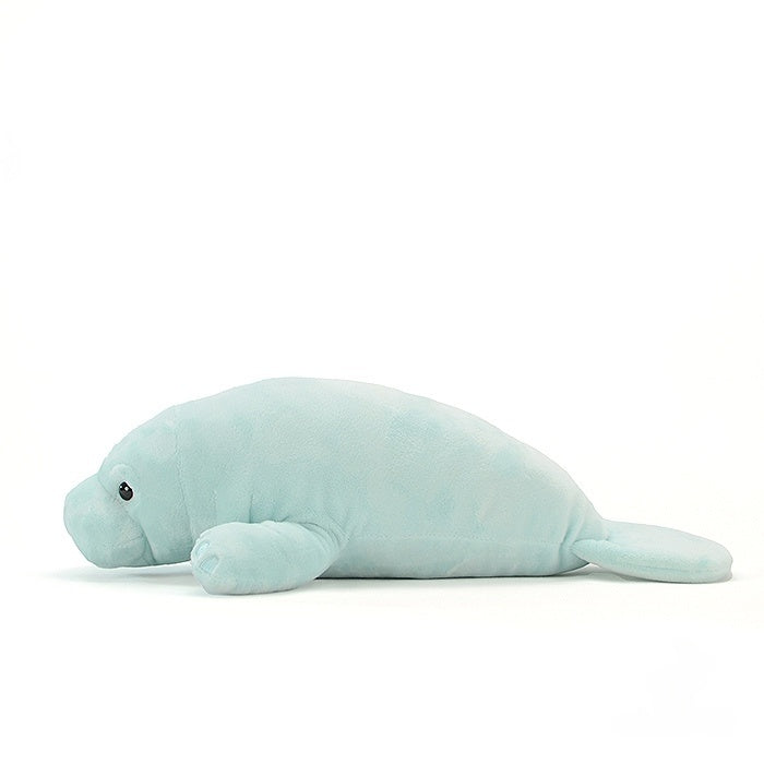 Side profile of a manatee stuffed animal, showcasing its lifelike shape and smooth texture