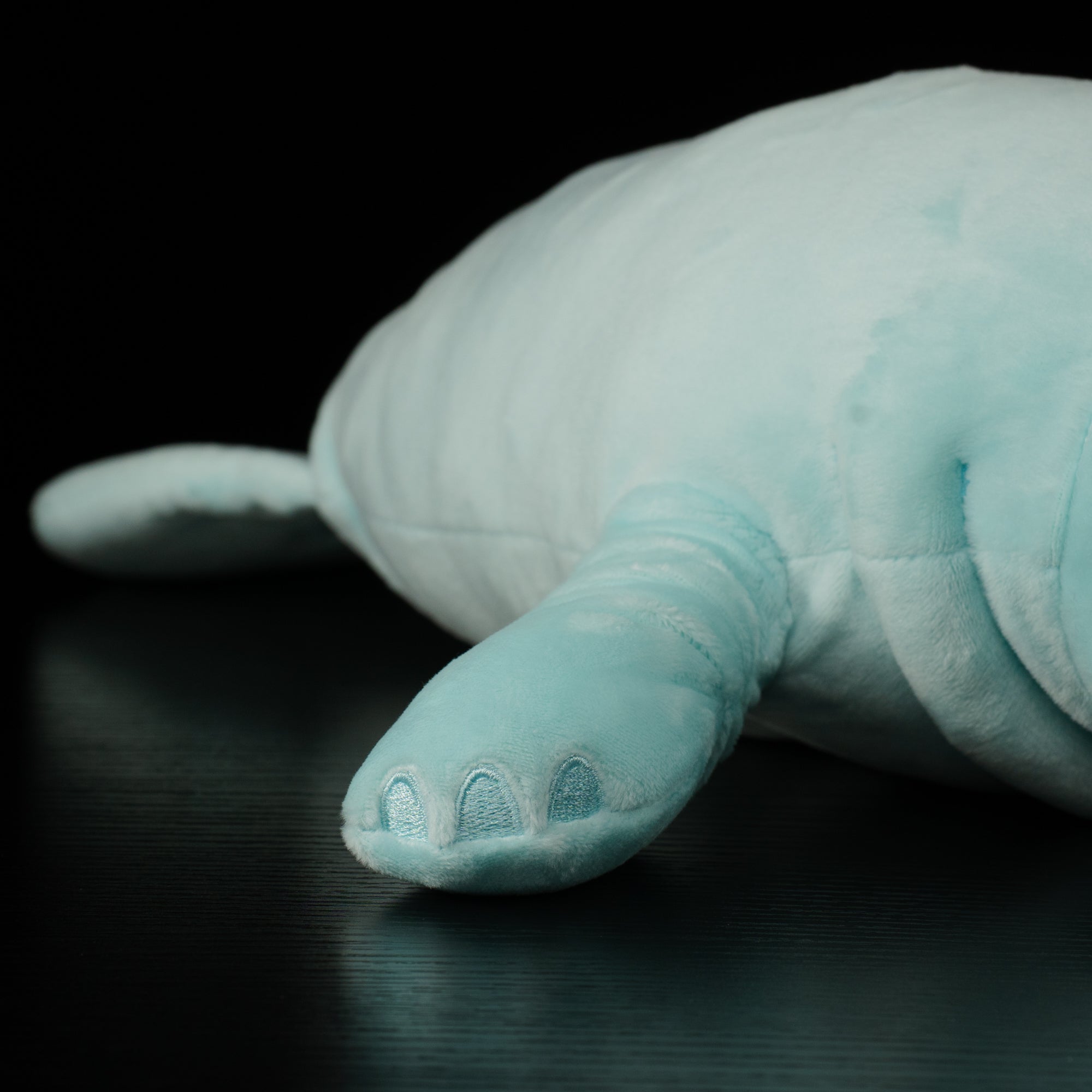 Flipper detail of manatee plush by SoftDaysLab®, highlighting texture and lifelike aquatic animal design