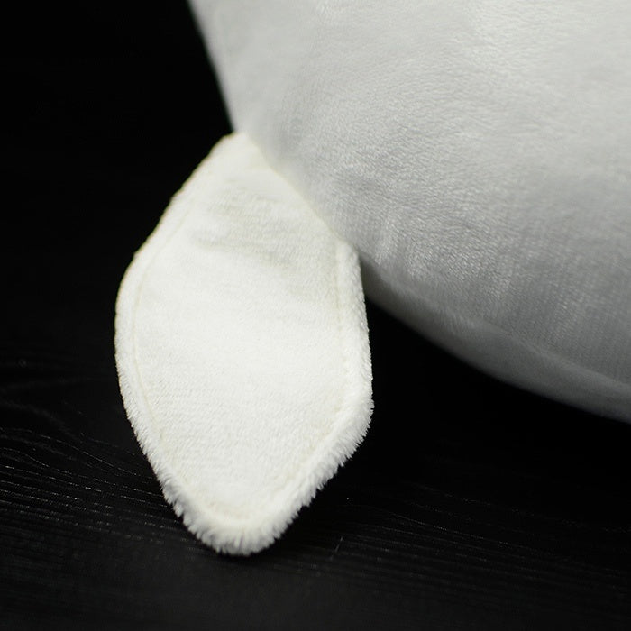 Close-up of the soft pectoral fin of a beluga whale plush toy, perfect for cuddling