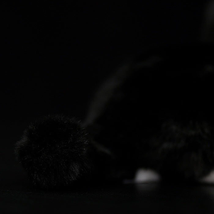 Close-up of the Tuxedo Cat plush toy’s fluffy tail, showcasing its soft texture and lifelike design