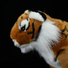 Close-up of tiger plush toy's head, capturing its lifelike features and detailed craftsmanship