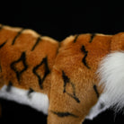 Detailed shot of the tiger plush toy's body, showcasing its realistic stripes and soft texture