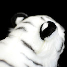 Detailed view of the soft ears and stripes of a white tiger stuffed animal, great for tiger enthusiasts