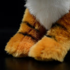 Close-up of soft tiger plush paws with realistic stripes, great for tiger and animal lovers