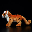 Side profile of a realistic tiger cub plush toy, showcasing detailed stripes and lifelike design