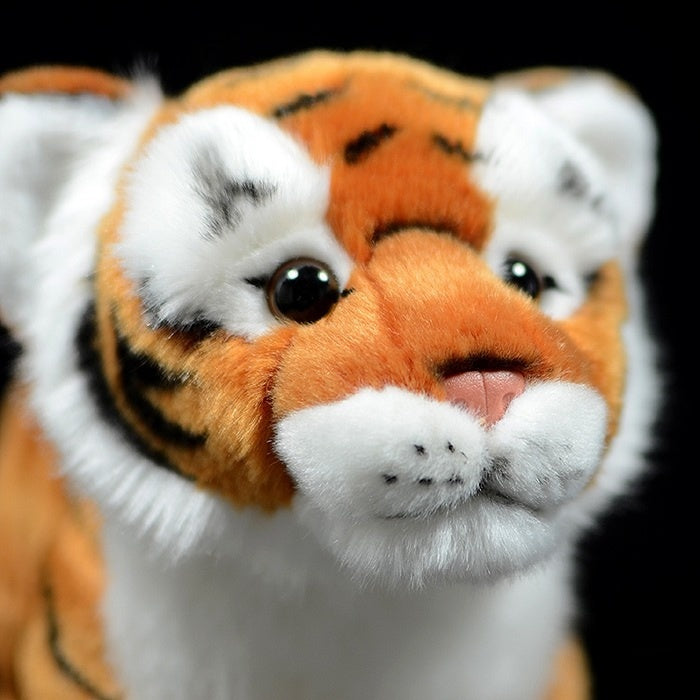 Close-up of a tiger cub plush face by SoftDaysLab, with lifelike eyes and detailed orange and black fur