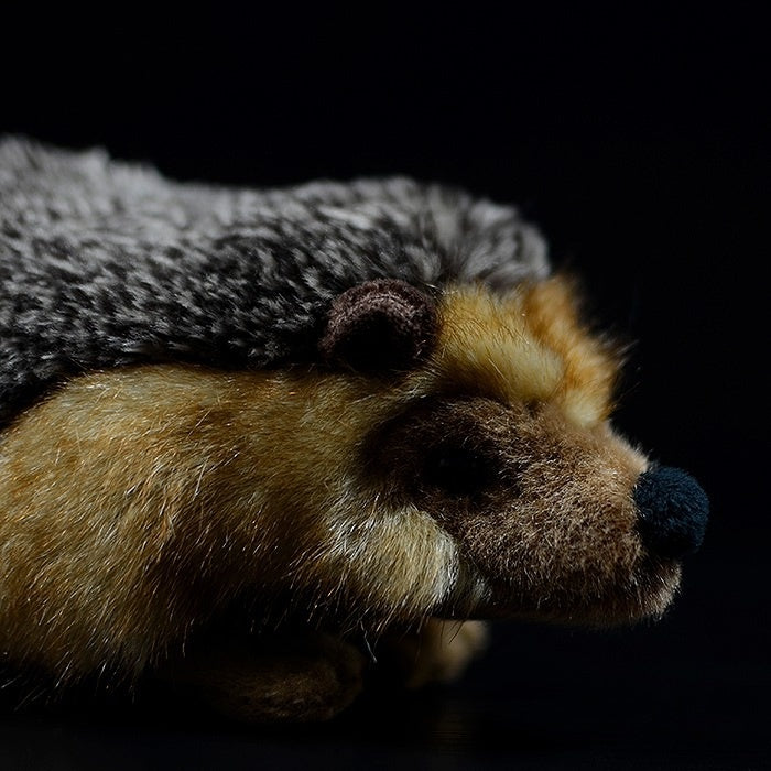 Side view close-up of a hedgehog plush toy showcasing its soft fur and lifelike design