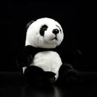 Lifelike giant panda plush toy by SoftDaysLab, sitting on a black background with iconic black-and-white fur