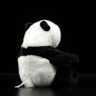 Back view of a giant panda plush toy, showing its fluffy tail and detailed craftsmanship