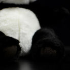 Detailed view of the giant panda plush toy's paw, designed with soft materials for a cuddly feel