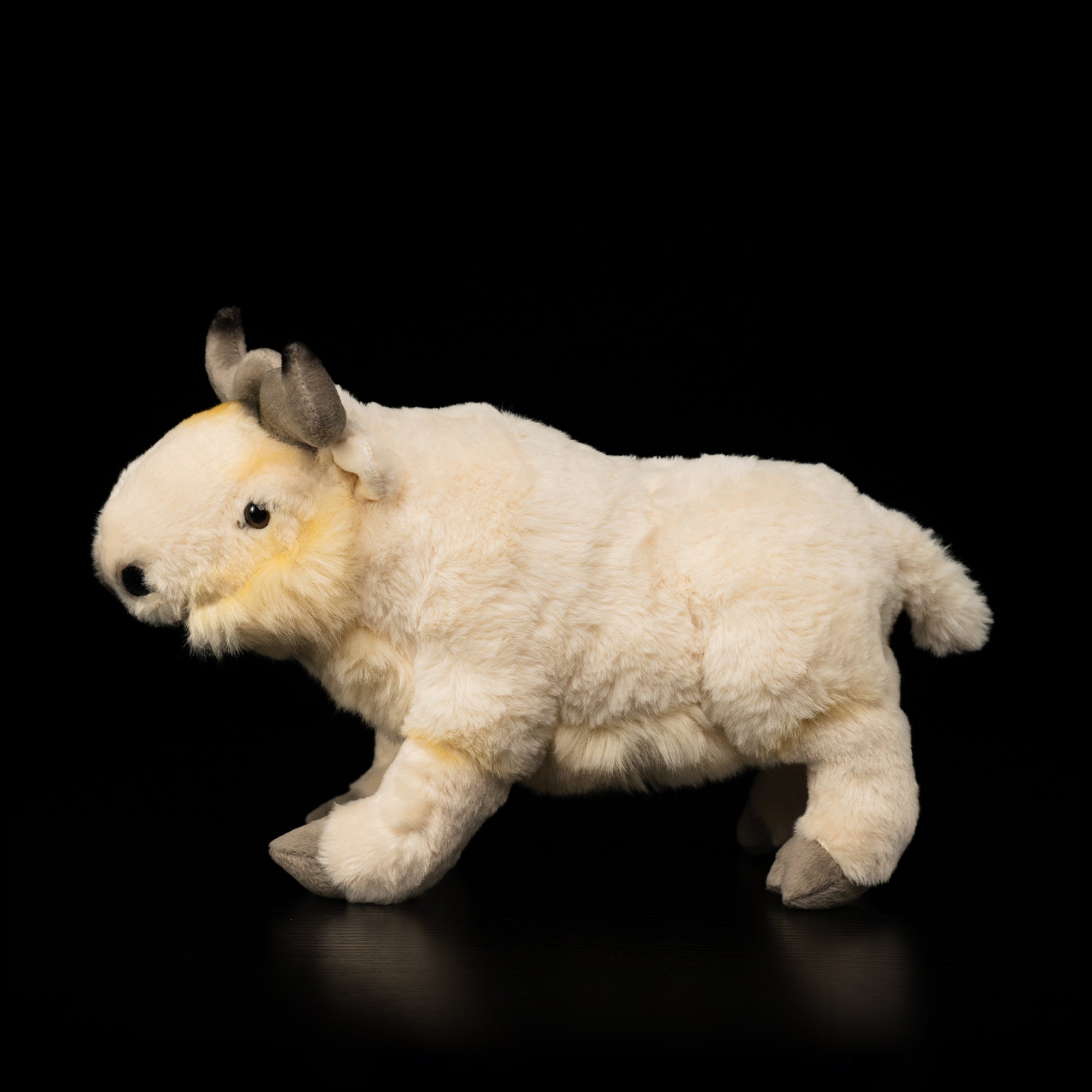 Full Side view of a realistic Takin stuffed animal with soft cream-colored fur and lifelike details by SoftDaysLab®
