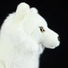 Profile view of the Arctic fox plush toy, featuring its realistic head and ear details