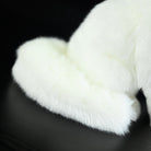 Close-up of the Arctic fox plush toy's fluffy tail, showcasing its soft and detailed design