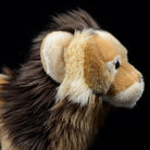 Side close-up of a lion plush toy’s head, highlighting its soft mane and lifelike features